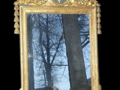 Miroir Louis XVI 18 ème en bois sculpté et doré