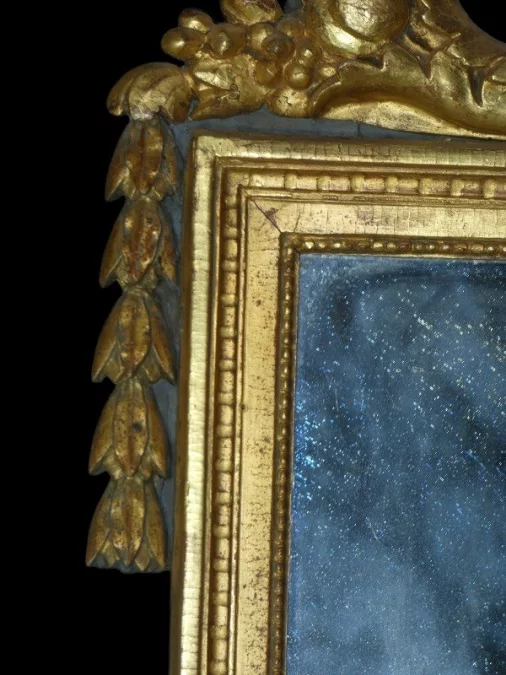 Miroir Louis XVI 18 ème en bois sculpté et doré