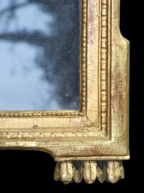 Miroir Louis XVI 18 ème en bois sculpté et doré