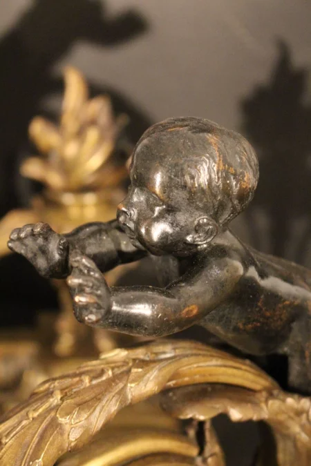 Paire de chenets aux anges en bronze